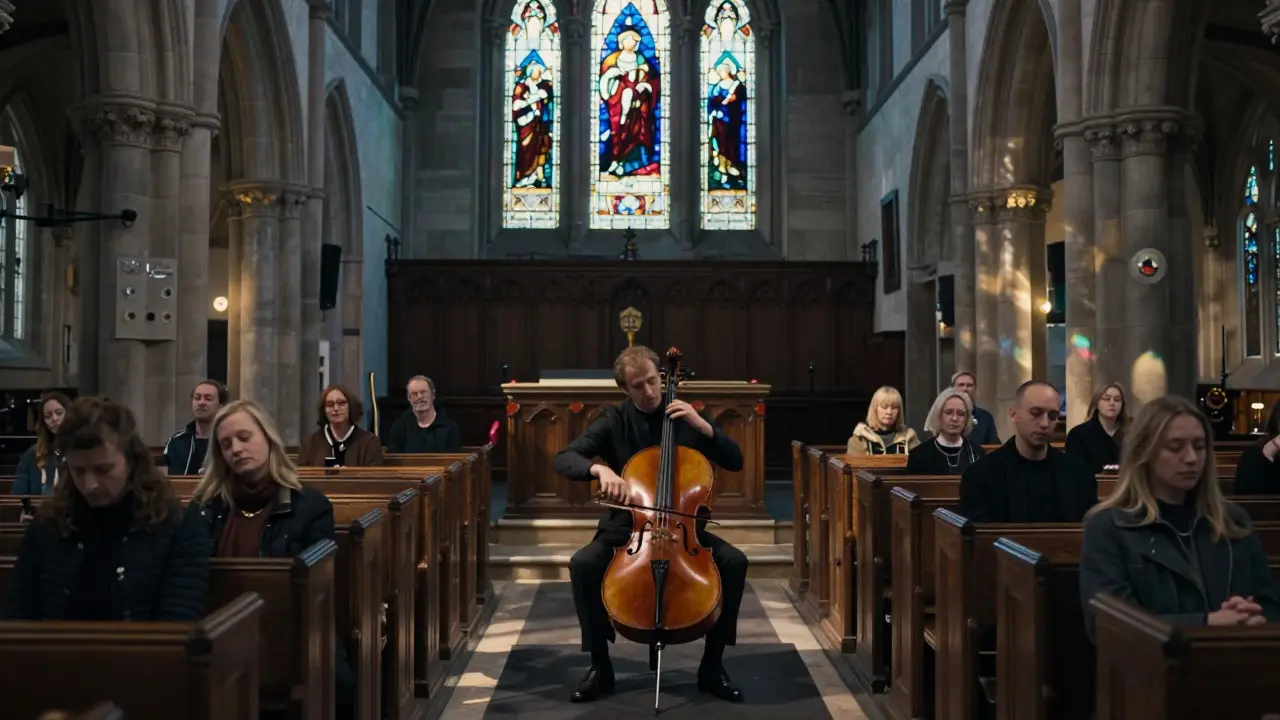 A cellist plays in a moonlit church nave, listeners seated on pews as colored light falls through stained glass.