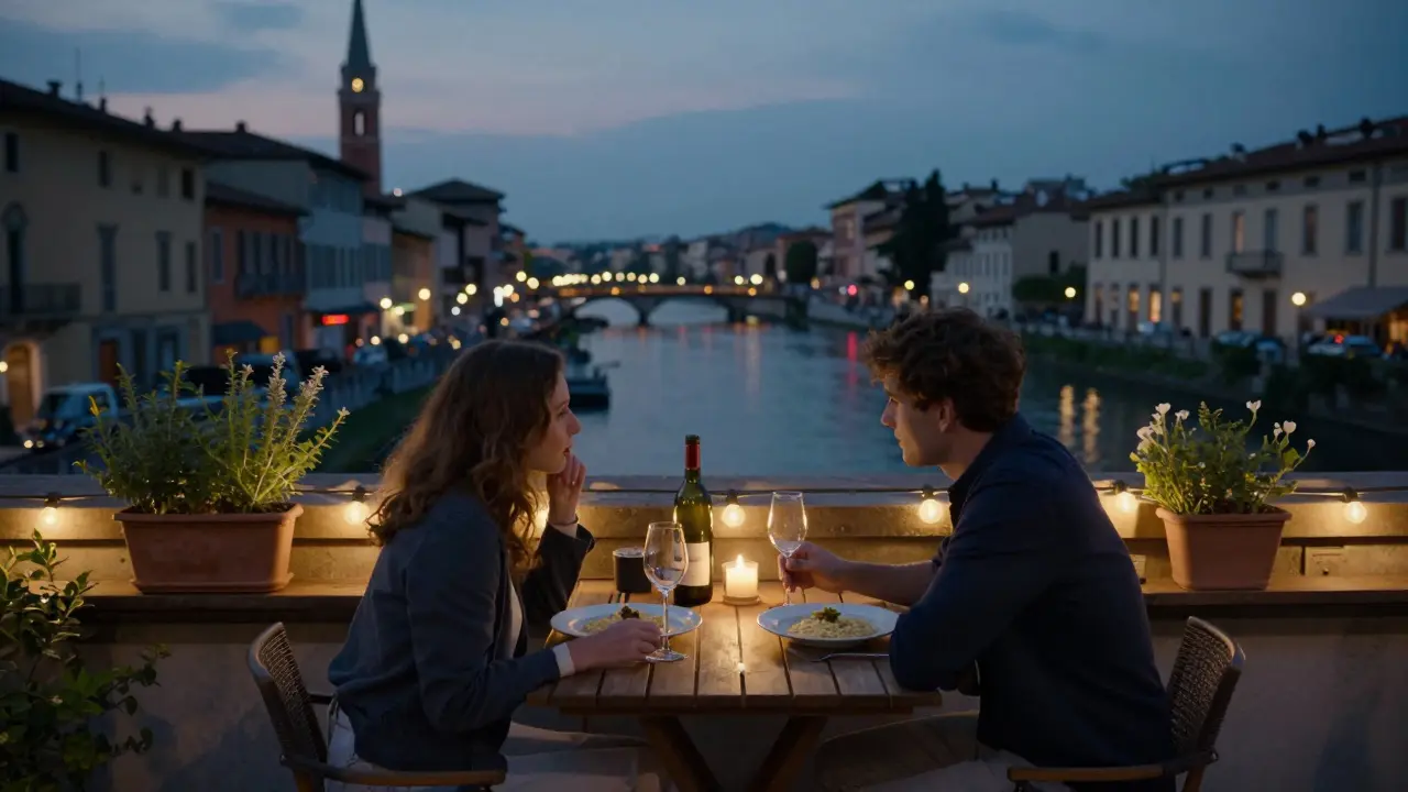 A couple enjoys a quiet rooftop dinner overlooking Milan's Navigli canals at twilight.
