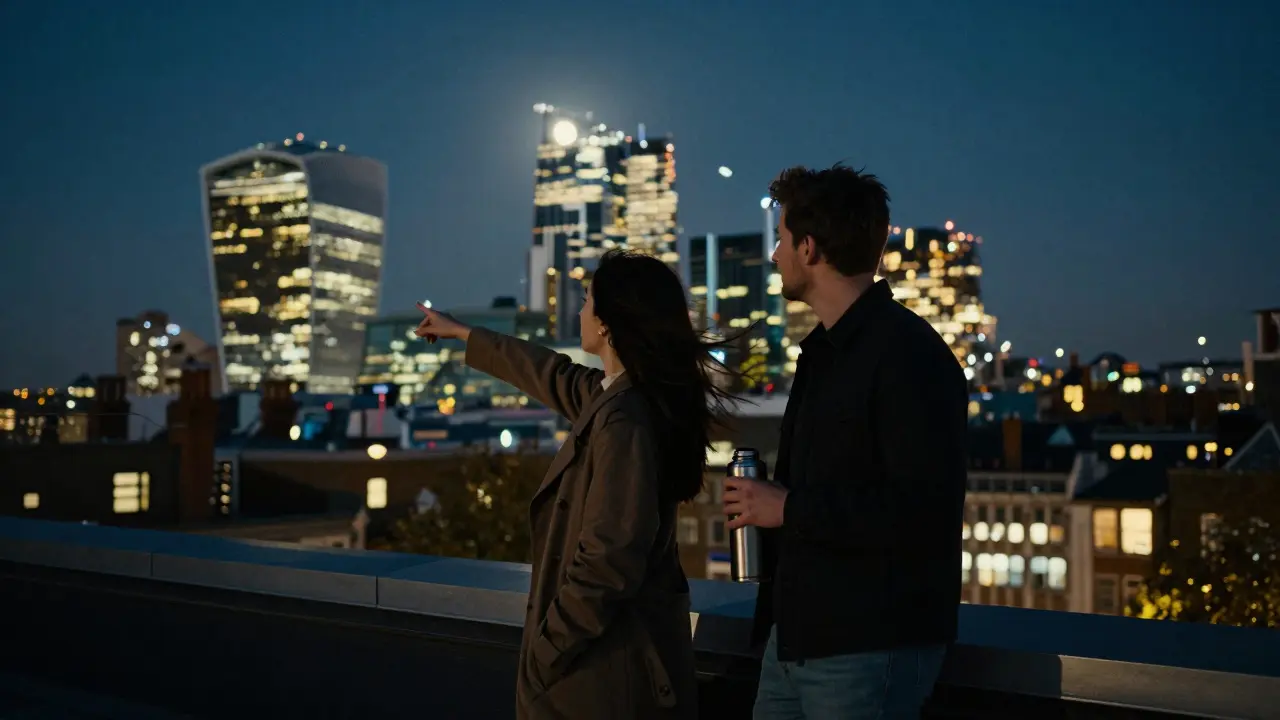 Two people on a Shoreditch rooftop at midnight, gazing at London's skyline in peaceful stillness.