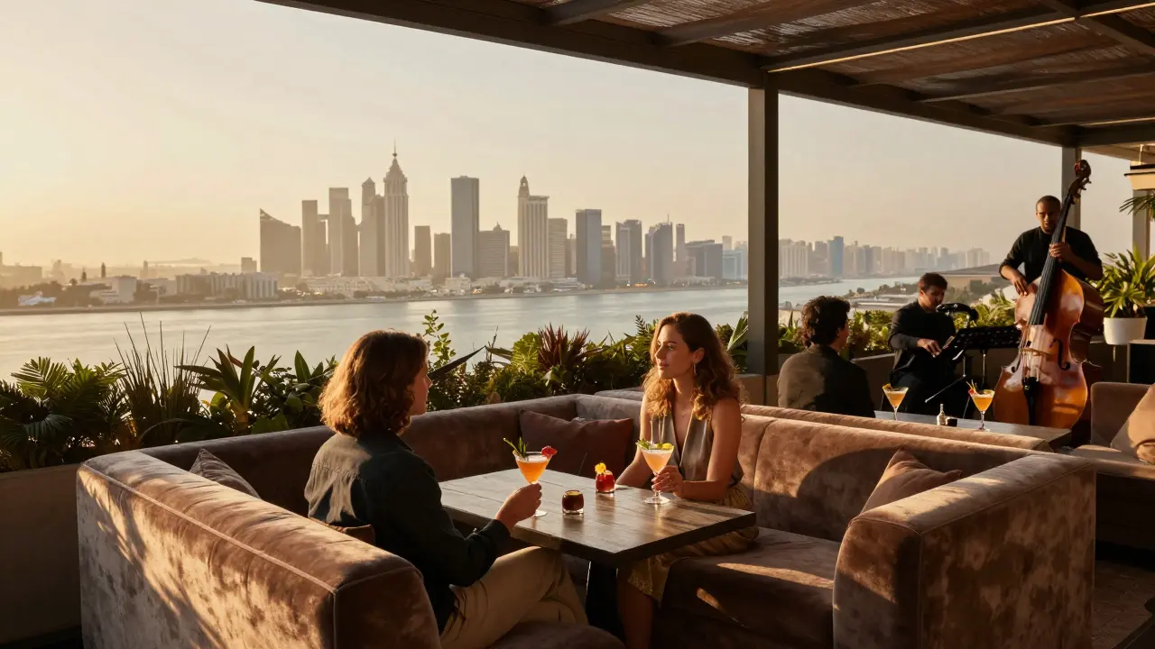 Couples enjoying cocktails at The Roof lounge with a glowing skyline and sea view, soft lighting and live jazz in the background.