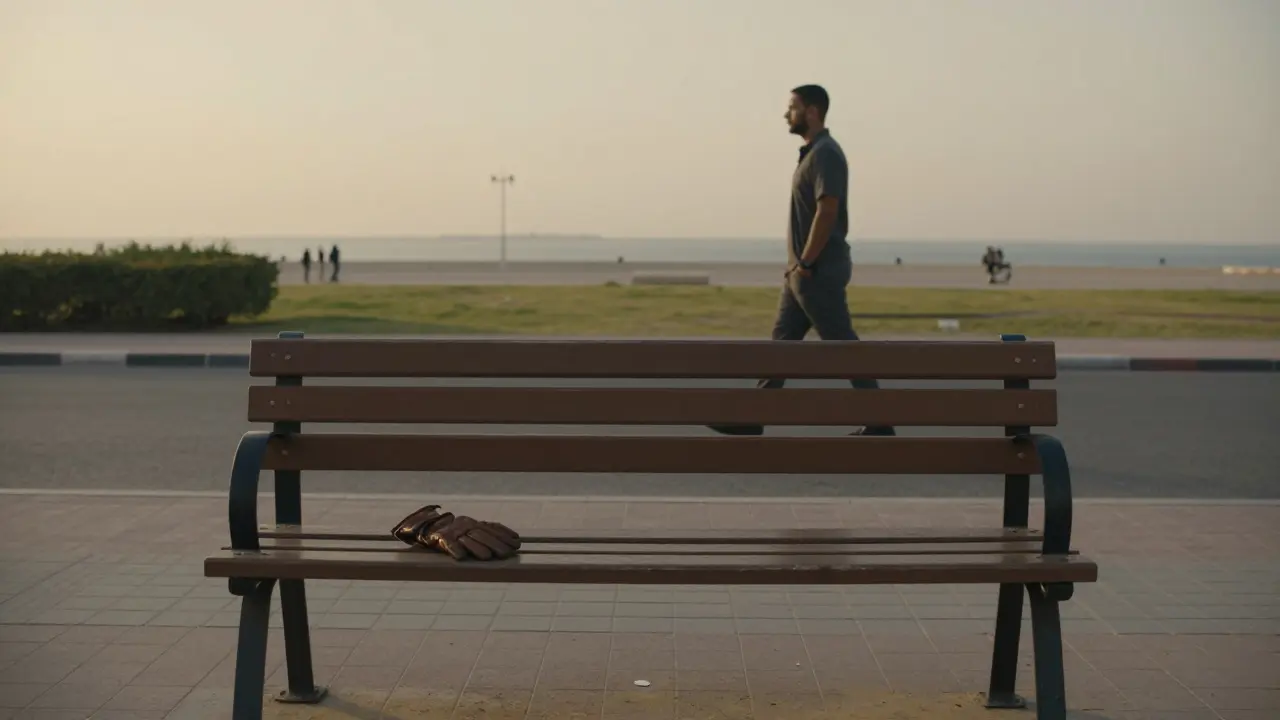 An abandoned leather glove on a park bench at dawn, symbolizing a quiet, respectful parting.